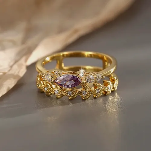 Crown ring with pink crystals.