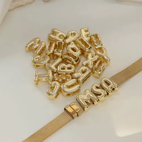 The set of letters and the mesh bracelet with three initials.