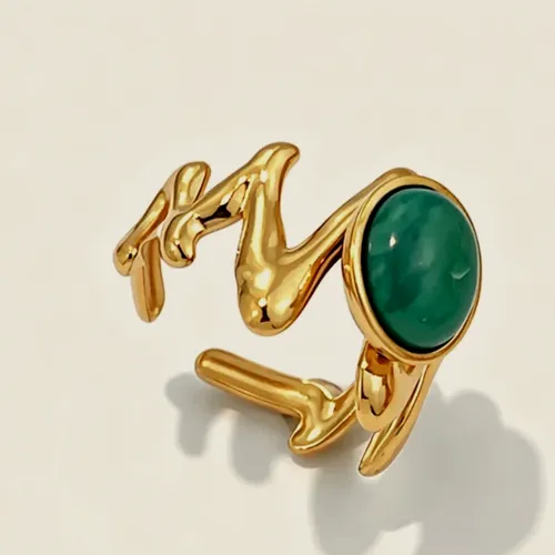 Wavy ring with a green stone.