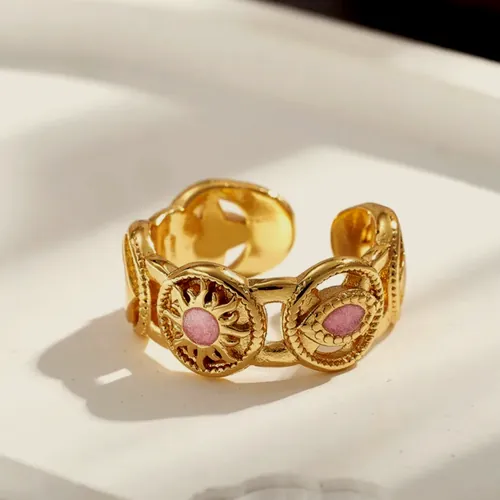 Wide ring with pink stones.
