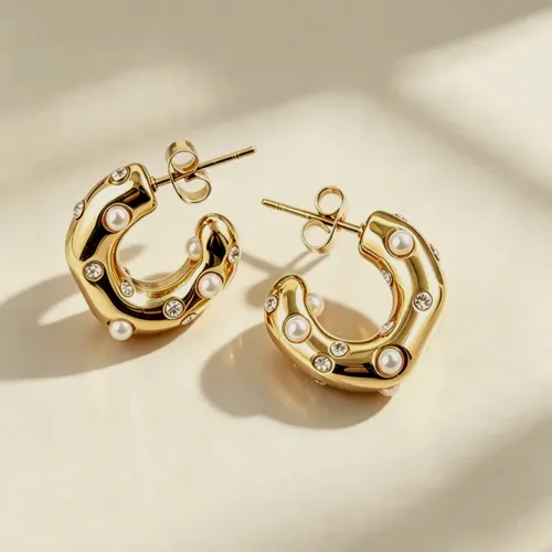 Wave earrings with a pearl.