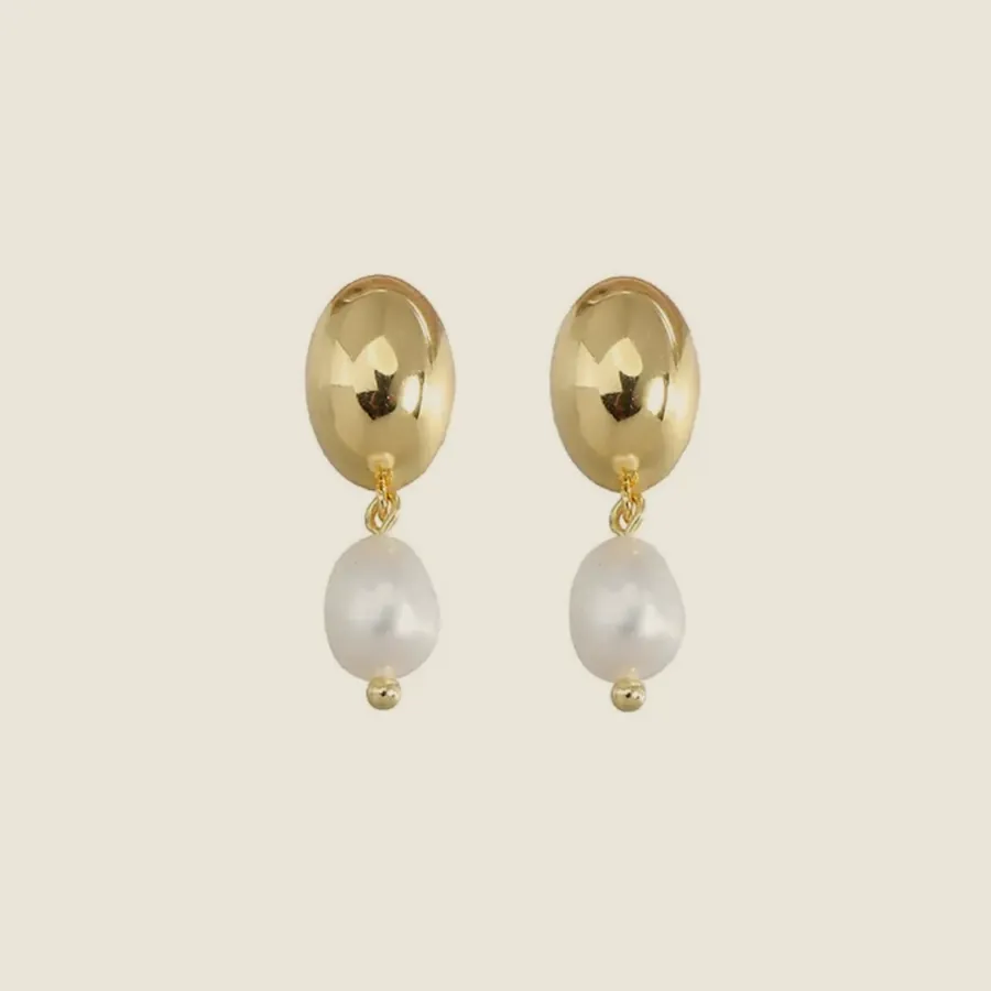 Gold oval earrings with a pearl.