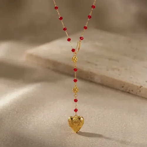 Red bead necklace with a heart.
