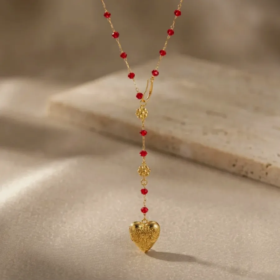 Red bead necklace with a heart.