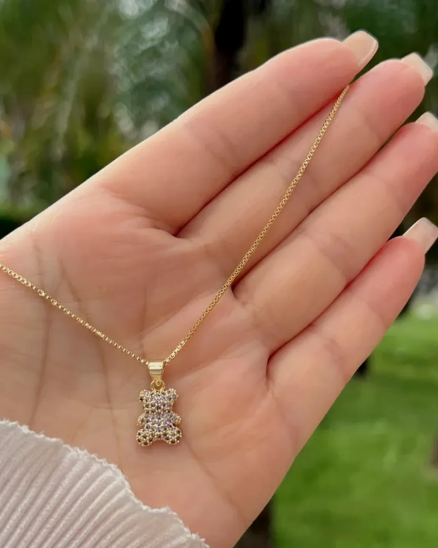 The cubic zirconia cross, held in the hand.
