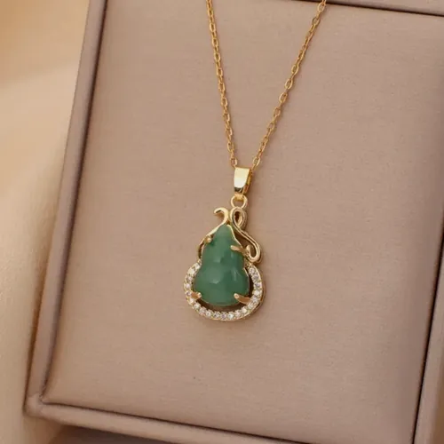 Necklace with a green crystal drop.