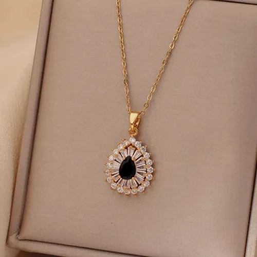 Necklace with a black drop and cubic zirconia.
