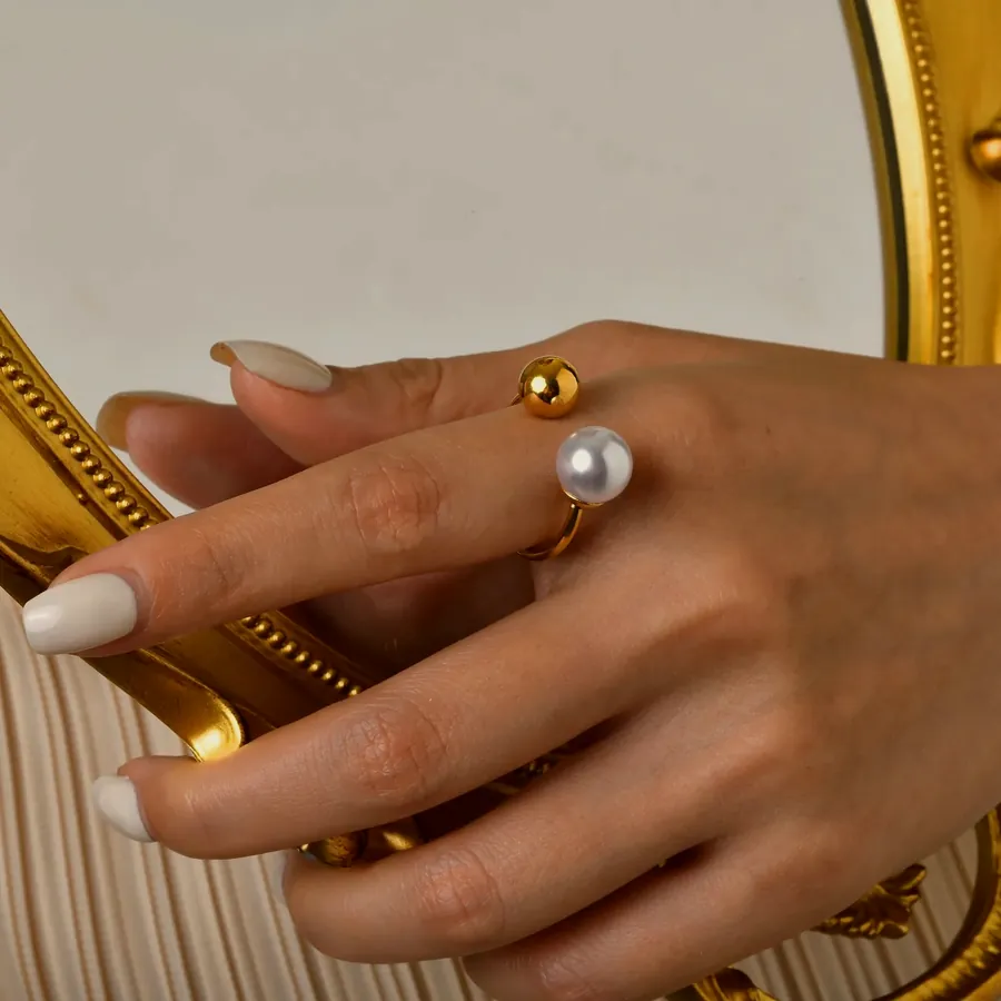 Open ring with gold ball and pearl.