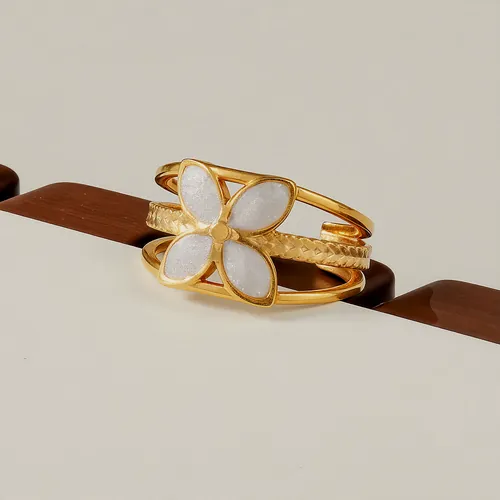 Ring with two nacre flowers.