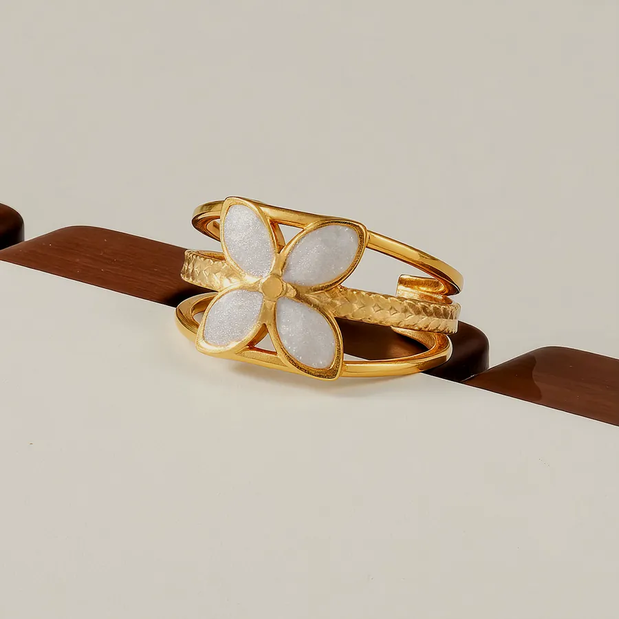 Ring with two nacre flowers.