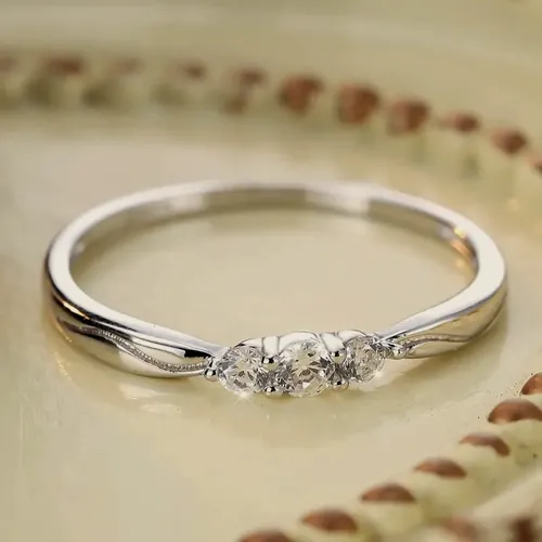 Silver-tone ring with three crystals.