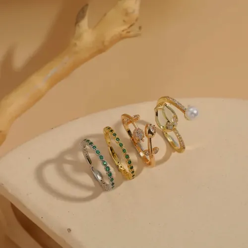 Gold rings with coloured crystals.