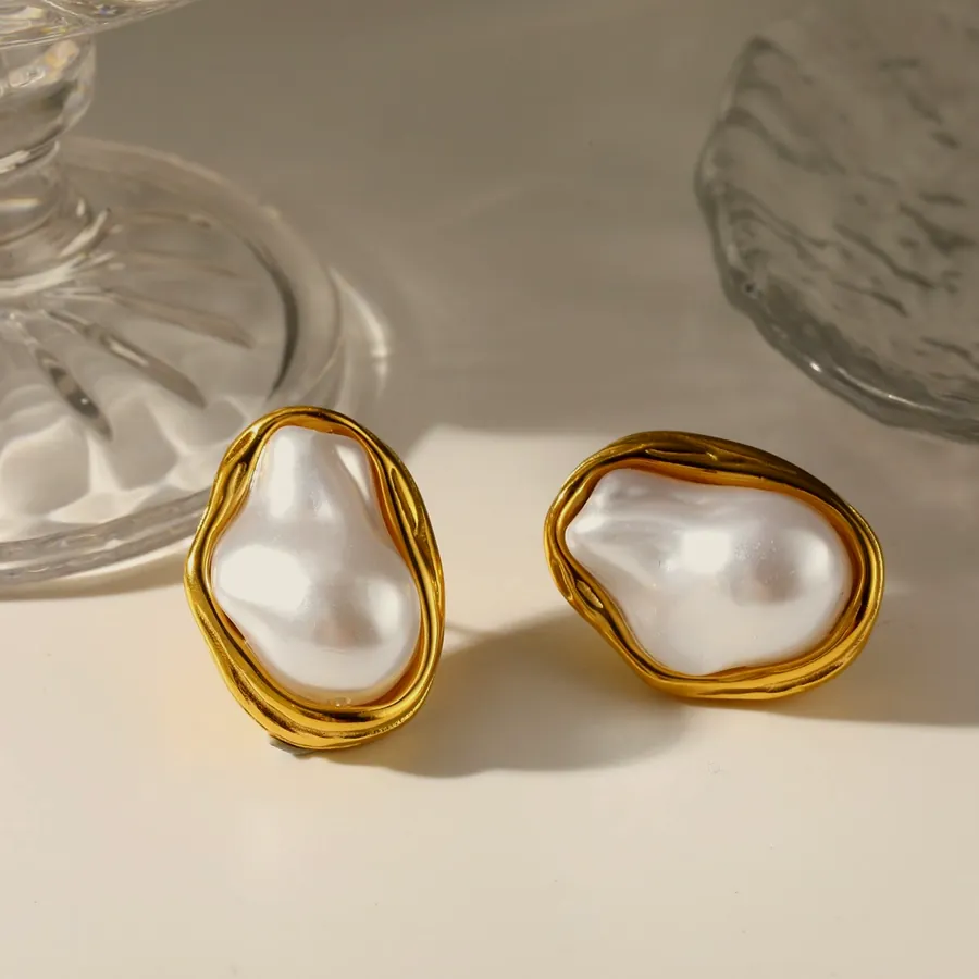 Gold baroque pearl earrings.