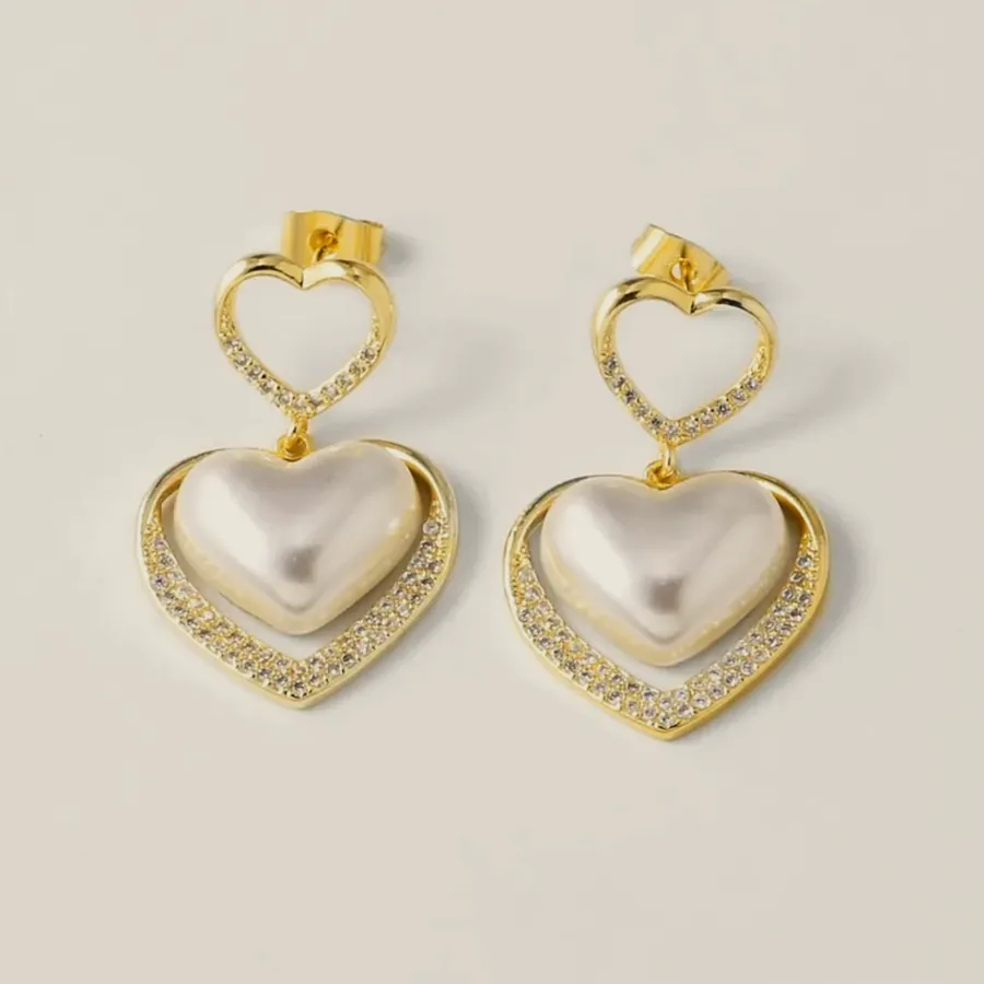 Nacre heart earrings with pavé.