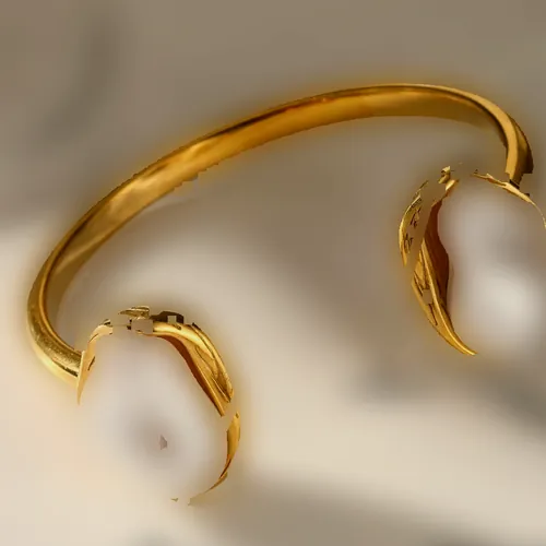 Open cuff with baroque pearls.