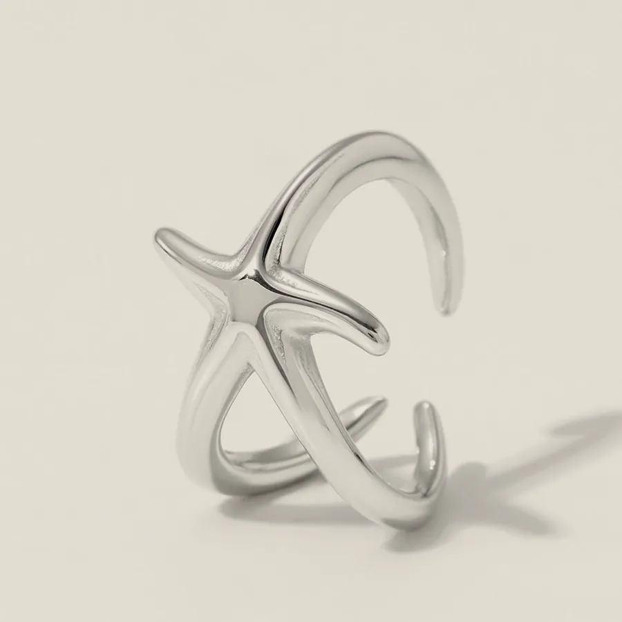 Silver-tone starfish ear cuff.