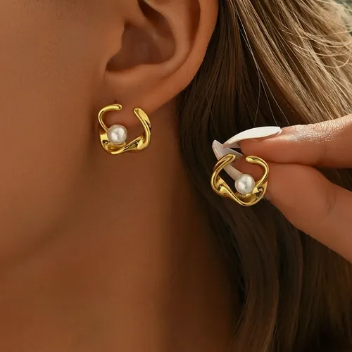 Pearl flower ear cuff, worn.