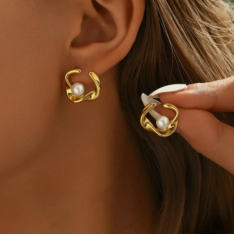 Pearl flower ear cuff, worn.