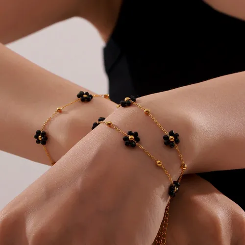 Black bead flower bracelet.