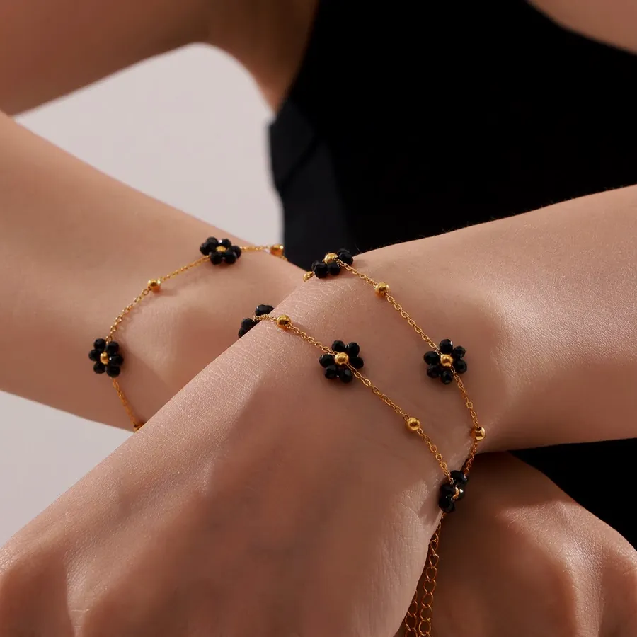 Black bead flower bracelet.