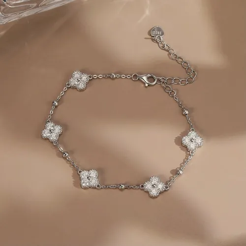 Silver-tone crystal clover bracelet.