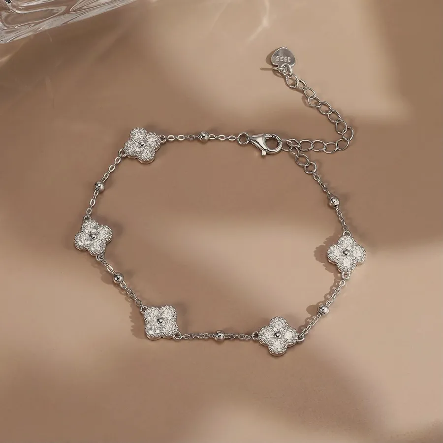Silver-tone crystal clover bracelet.