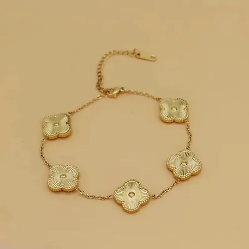 Etched gold clover bracelet.
