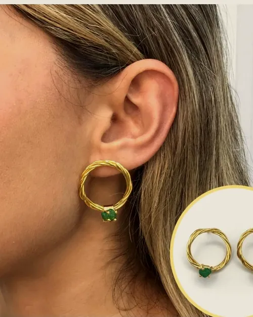 Gold hoop with raw emerald, worn.