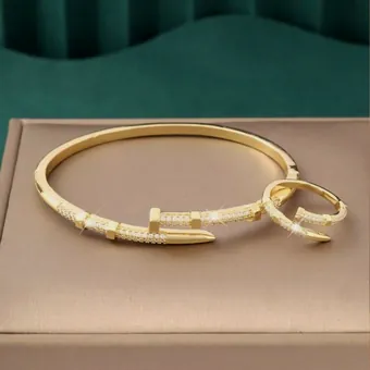 The bangle and ring set on a case.
