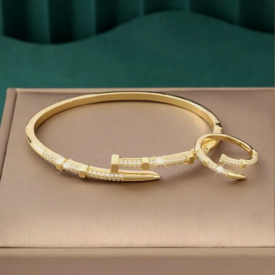 The bangle and ring set on a case.