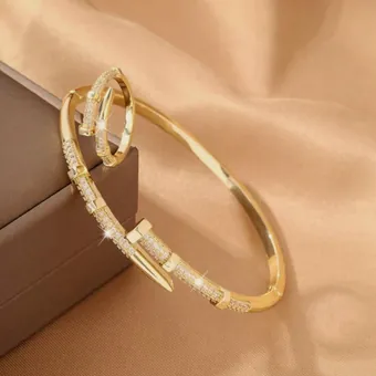 Gold nail bangle and ring set.