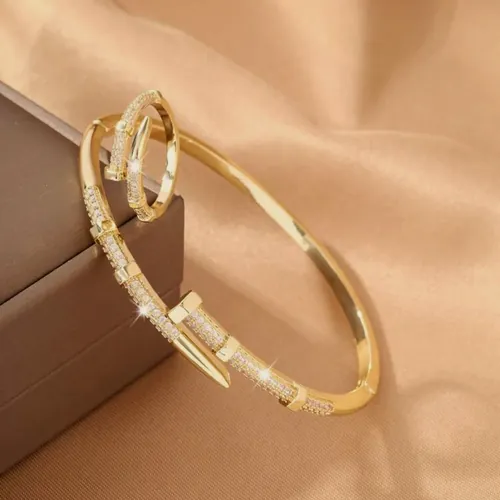 Gold nail bangle and ring set.
