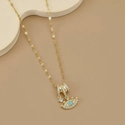 Necklace with a moon charm and cubic zirconia.
