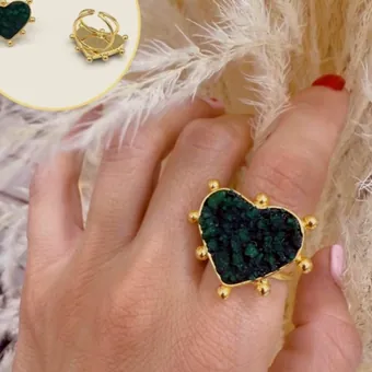 Heart ring and stud set with raw emerald, on a house card.