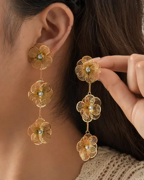 Long triple flower earrings, worn.