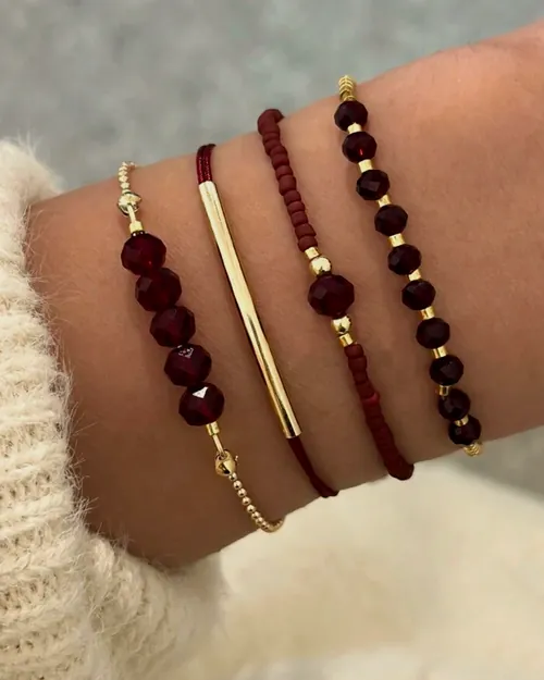 Burgundy bead bracelet set, worn.