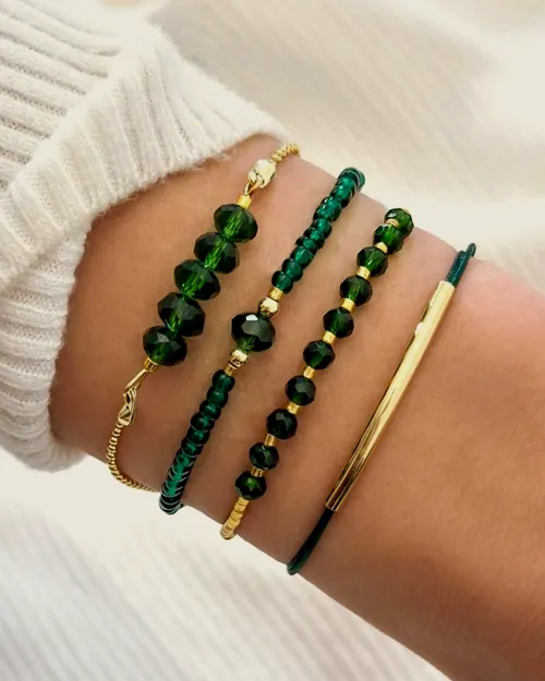 Green bead bracelet set, worn.