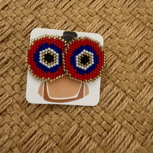 Large beaded eye stud earrings.