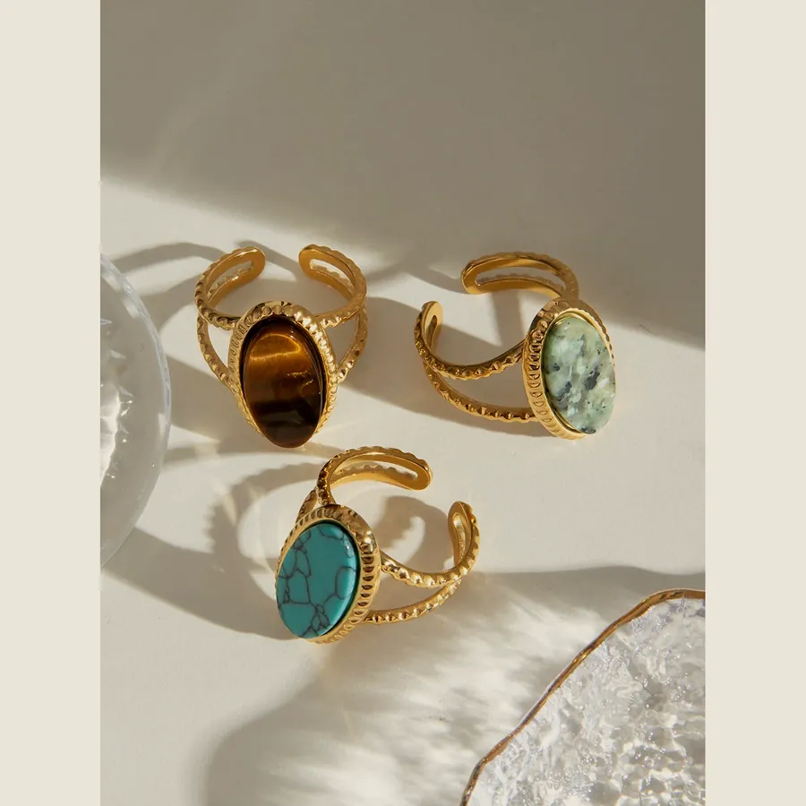 Three wrap rings with tiger's eye, amazonite and turquoise.