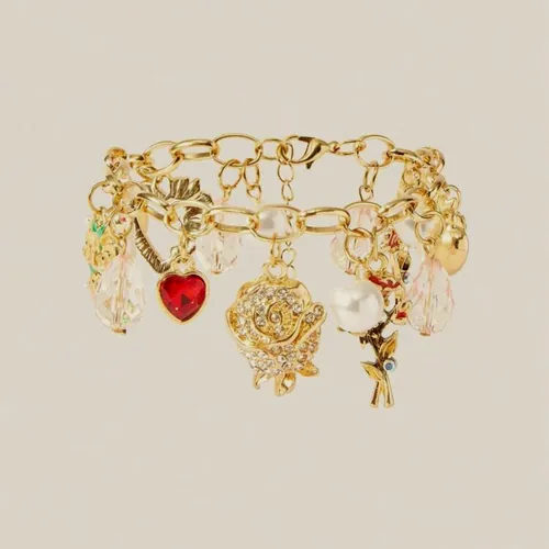 Gold bracelet loaded with assorted charms.