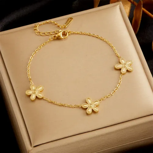 Golden flower bracelet in its case.