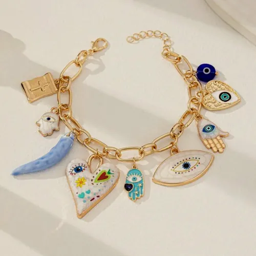 Gold bracelet with evil eye charms.