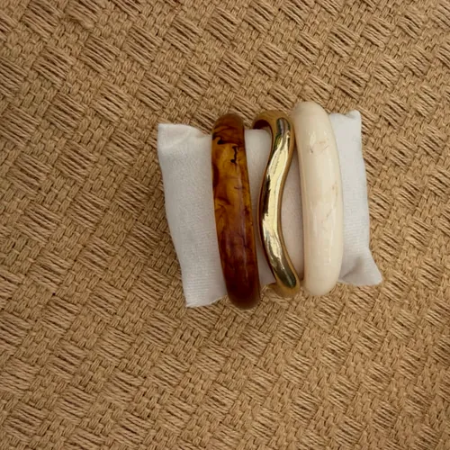 Set of three resin bangles.