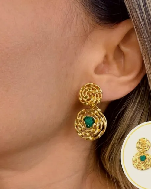 Double rosette earrings worn on the ear.