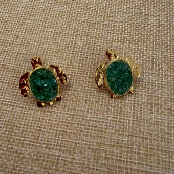 Turtle earrings with raw emerald shells.