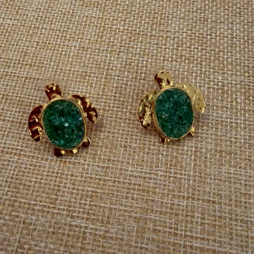 Turtle earrings with raw emerald shells.