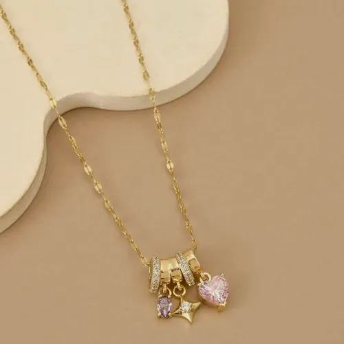 Fine necklace with a gold charm cluster.