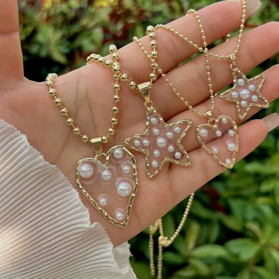 The pearl heart and star pendants.