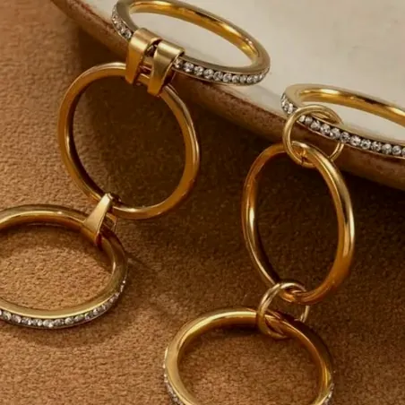 Double gold hoop earrings with cubic zirconia.