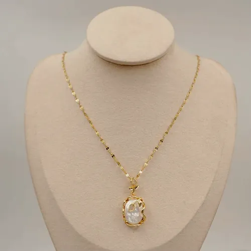 Crystal drop necklace on a bust.